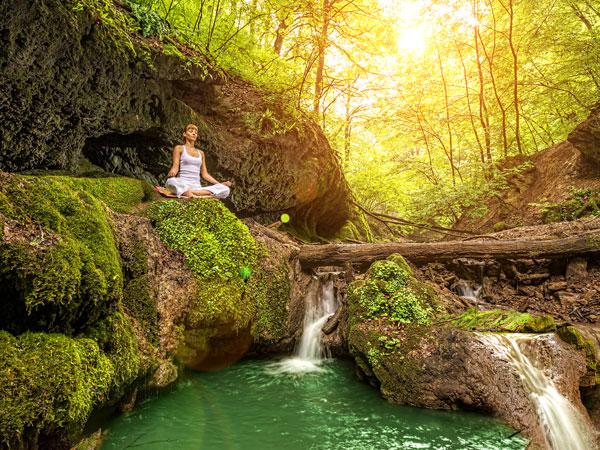 Woman Meditating in Woods — Greensboro, NC — Merlin Centre For Hypnosis & Enlightenment Woman Meditating in Woods — Greensboro, NC — Merlin Centre For Hypnosis & Enlightenment