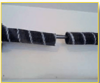 Broken Wire Repair Service — Guaranteed Door Service, Inc. Close-up of a black-and-white striped cable or rope against a light background.