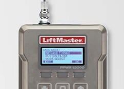 LiftMaster garage door opener control panel with small lit LCD screen and buttons