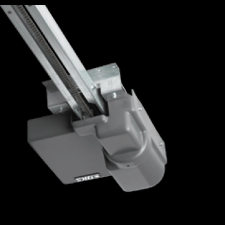 Commercial Overhead Door Operator — Guaranteed Door Service, Inc. Close-up of a gray industrial rail-mounted mechanical device on a black background