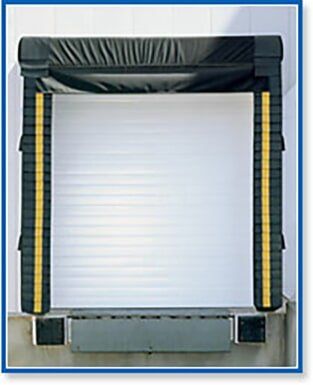 Industrial roll-up door framed by black and yellow safety padding