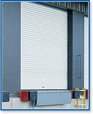 Closed white loading dock door with gray frame and bumper guards