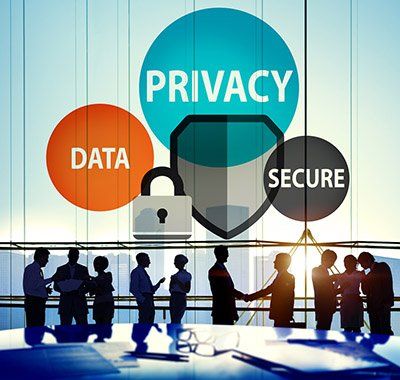 A group of people are shaking hands in front of a sign that says privacy data and secure.