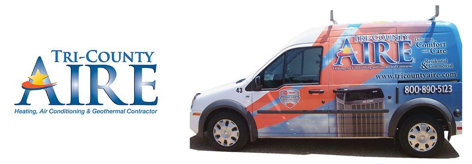 A tri-county aire van is parked next to a tri-county aire logo