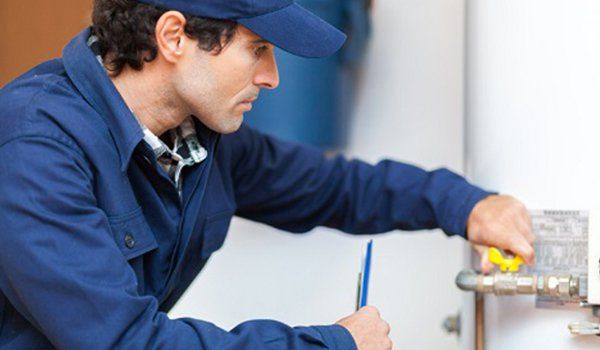 A repairman performing boiler repair services in California, MD A specialist that works on HVAC maintenance near Lusby, MD