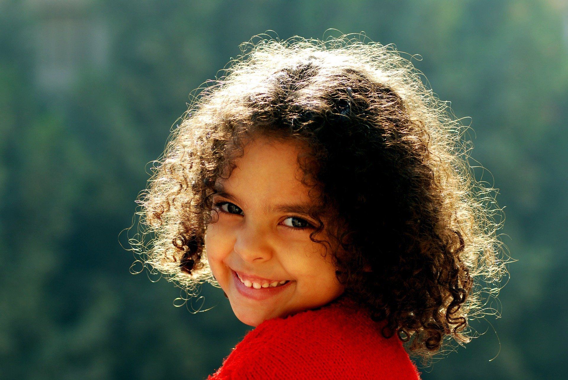 girl-with-curly-hair-smiling