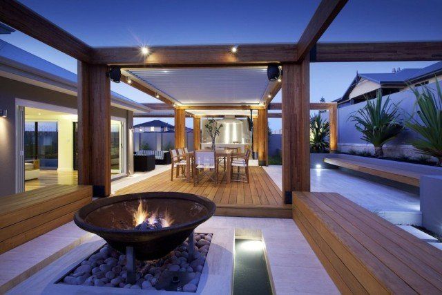 Firepit and dining area in outdoor room