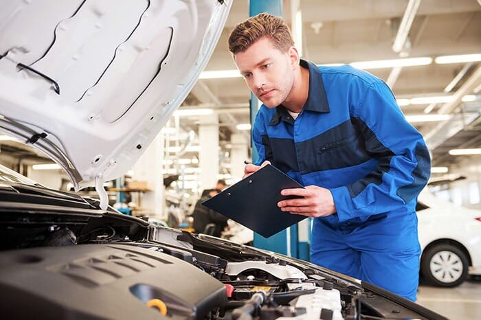 Car Mechanic Inspecting Engine - Service Station in Missoula, MT