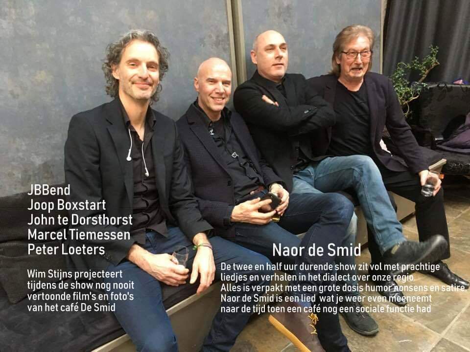 Four men seated together; text identifies them as a band named JBBand.