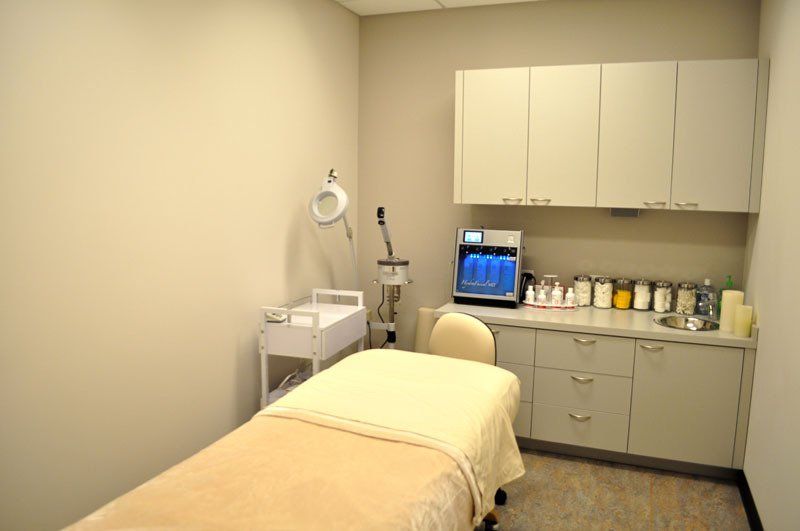 There is a massage table in the middle of the room.