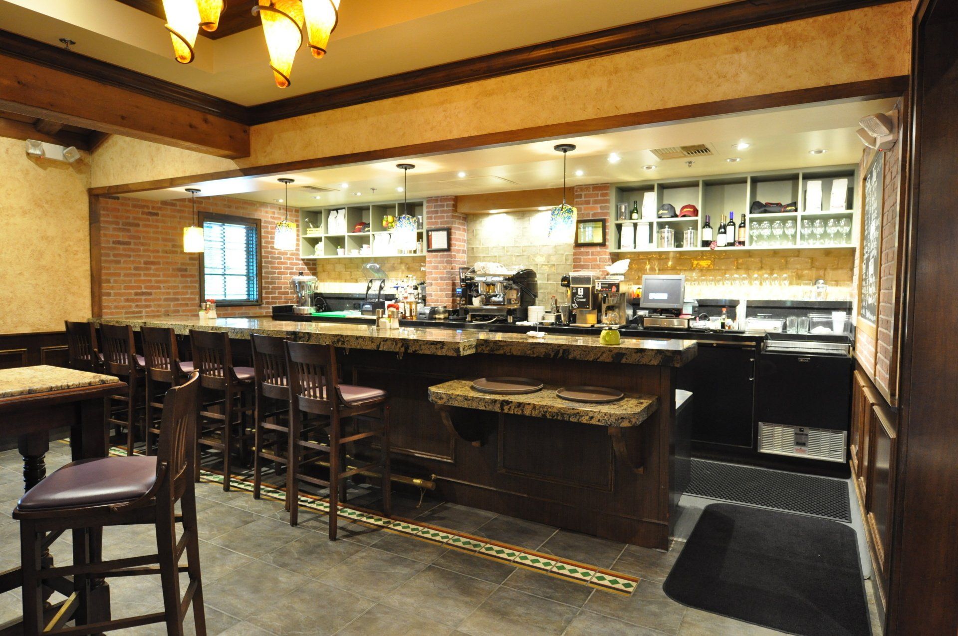 A restaurant with tables and chairs and a bar