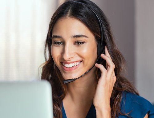 Interactive Voicemail — Smiling Woman While Talking to Customer in Akron, OH