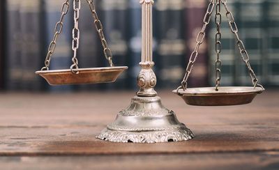 Scales Of Justice And Law Books — Tucson, AZ — Joshua Marshall Law