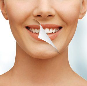 Checking The Whiteness of a Patients Teeth — Fort Myers, FL — Children & Adult Dentistry Checking The Whiteness of a Patients Teeth — Fort Myers, FL — Children & Adult Dentistry