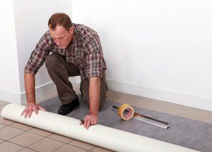 man layout carpet over vinyl tiles