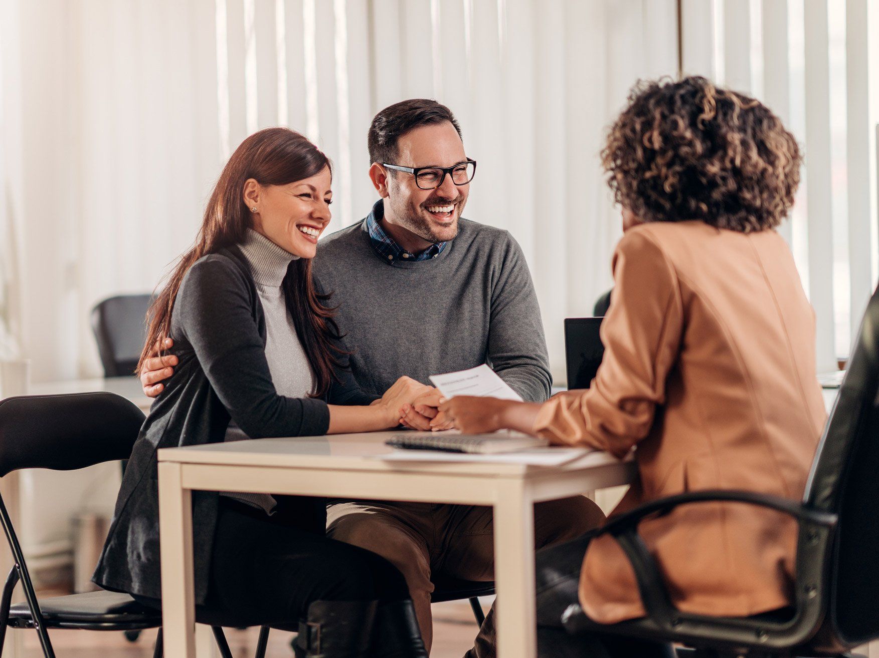 Happy Couple Consulting Insurance Agent — Alexandria, LA — Best & Swains Insurance Agency Happy Couple Consulting Insurance Agent — Alexandria, LA — Best & Swains Insurance Agency