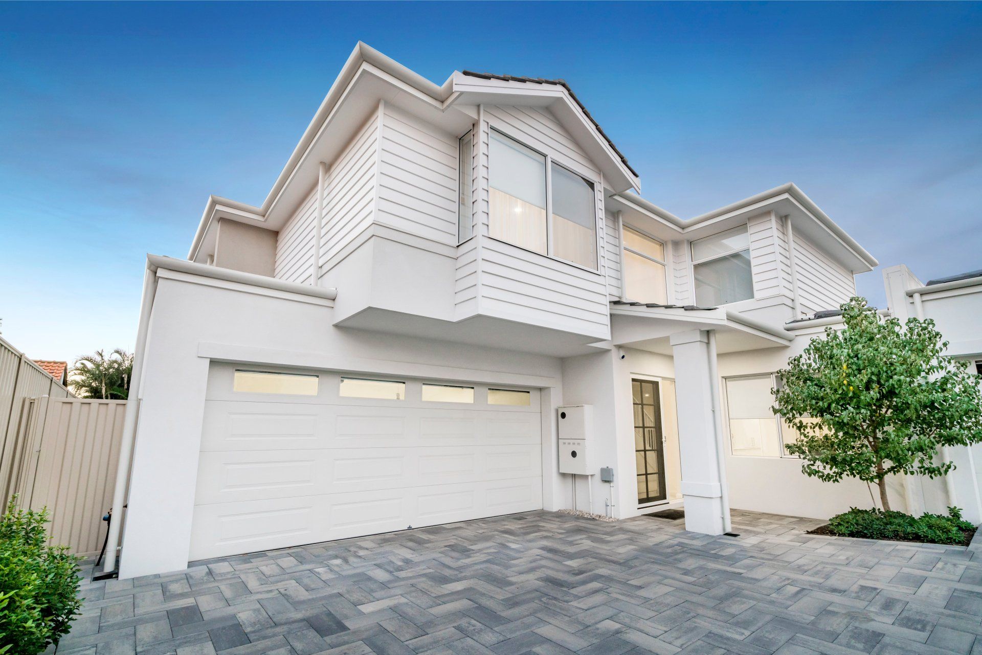 white modern house with grey brick unistone