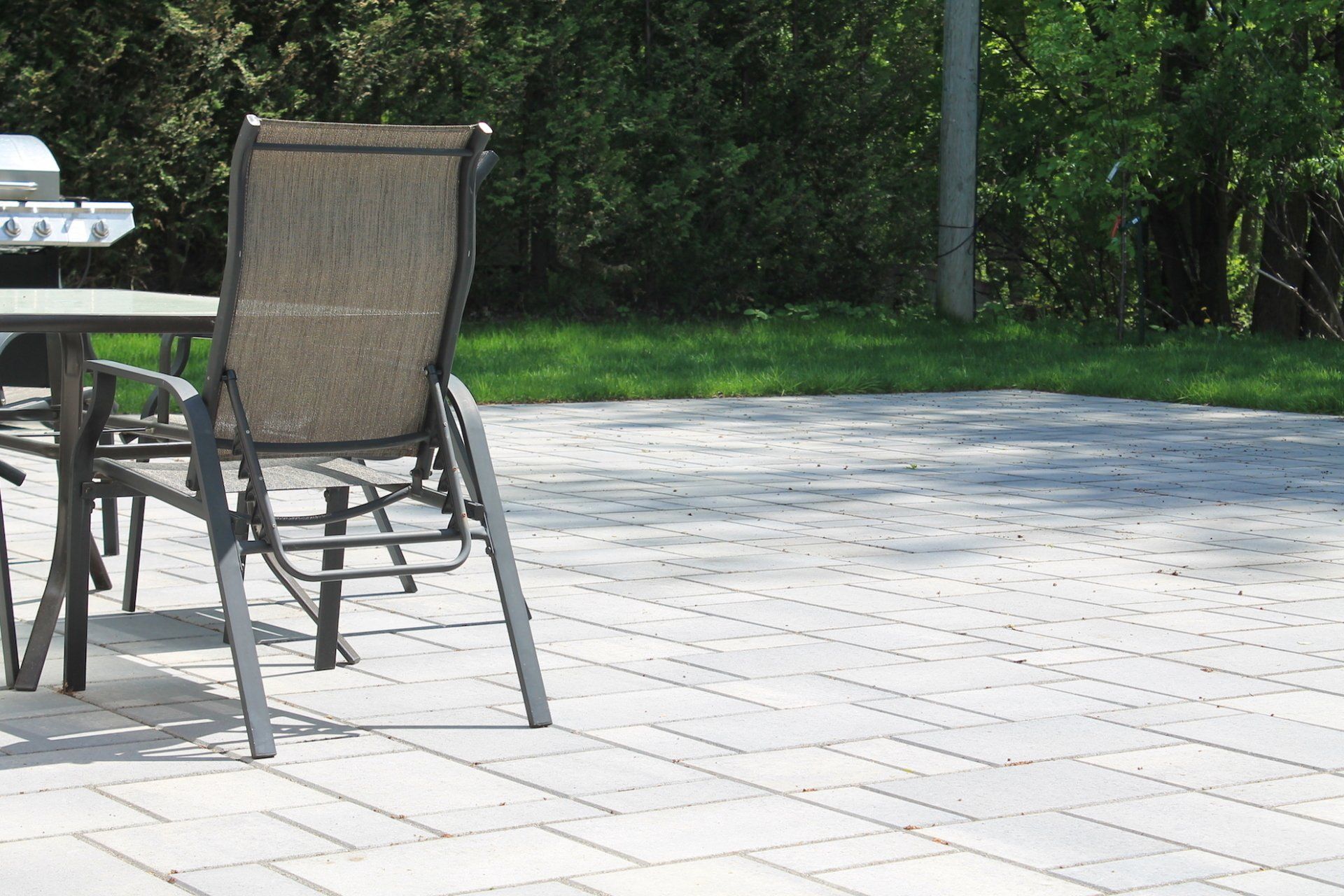 grey and beige unistone and patio chair