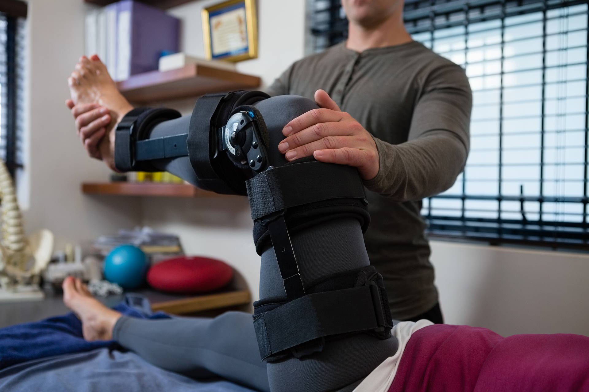 Sports Therapy — Therapist Working on Injured Leg in Woburn, MA Sports Therapy — Therapist Working on Injured Leg in Woburn, MA