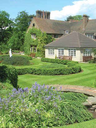 For a professional, reliable ground maintenance team call today. Picture of County house on a summers day with the grass freshly cut.