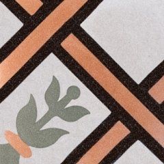 una piastrella di color bianco, marrone e arancione con disegni a righe
