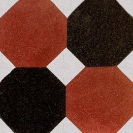 una piastrella di color bianco, arancione e marrone con i disegni a esagone