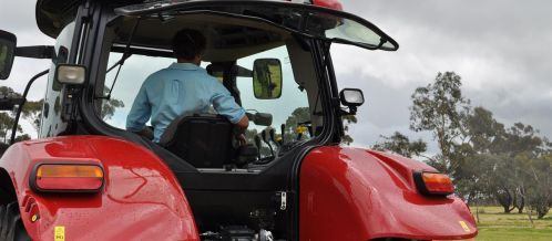 close up on man in tractor
