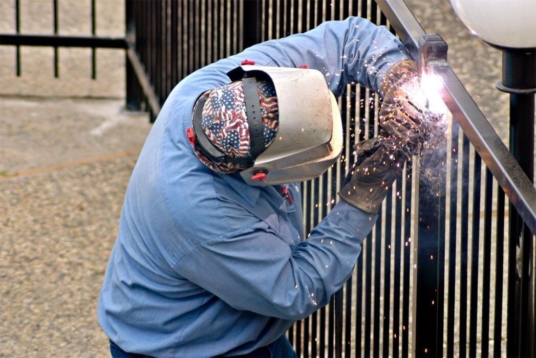 Contractor Welding a Fence - Metalworking in Portland, OR Contractor Welding a Fence - Metalworking in Portland, OR