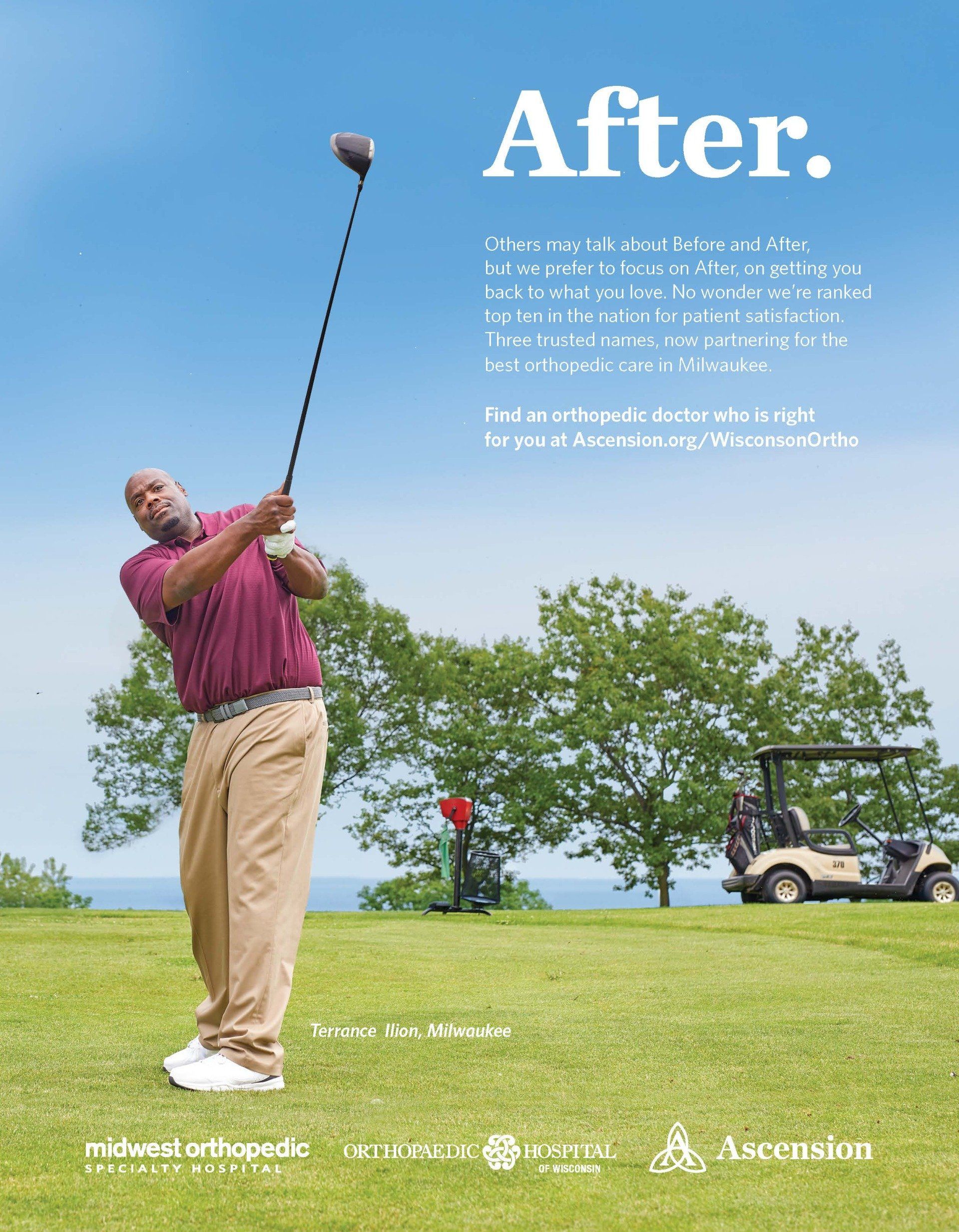 A man is swinging a golf club on a golf course.