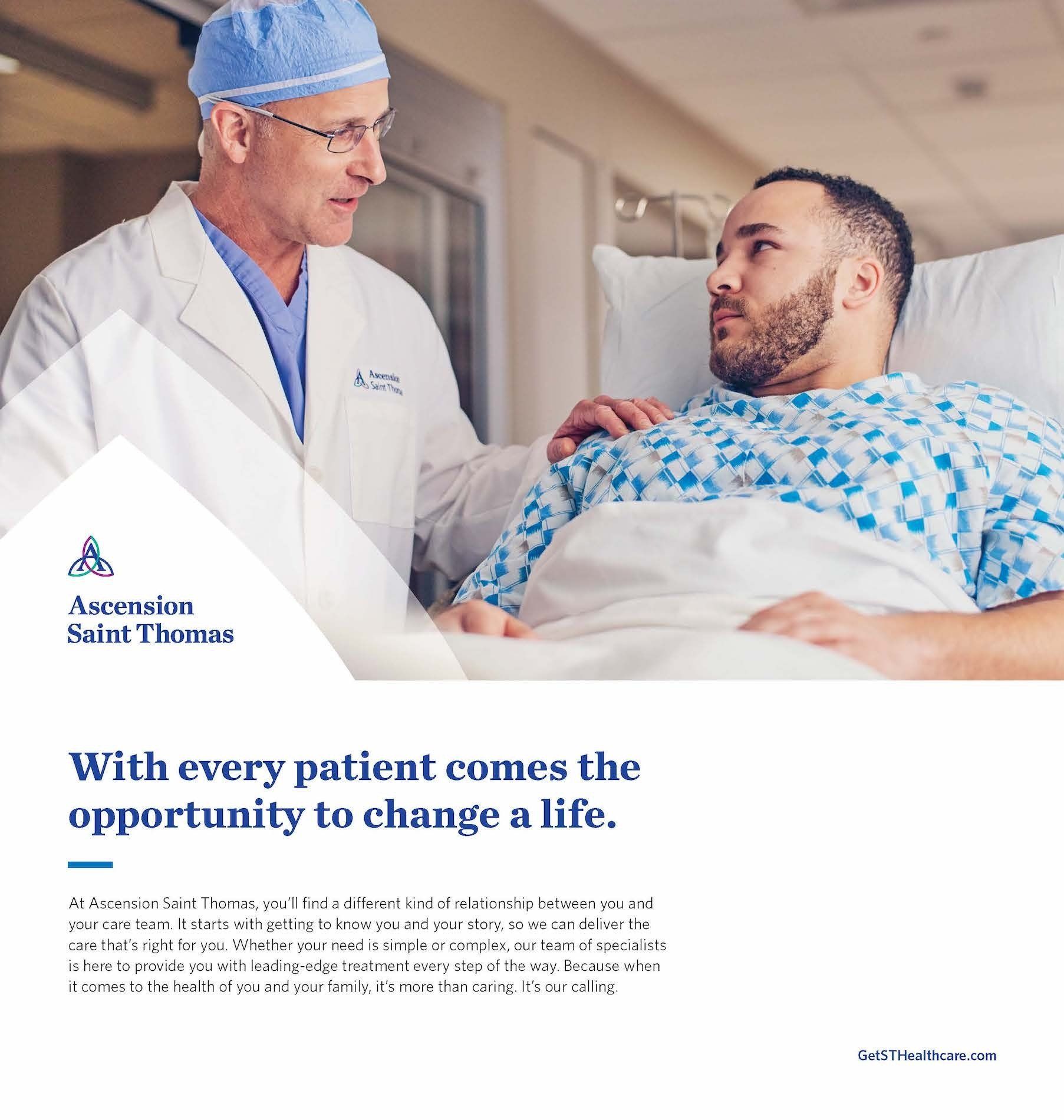 A doctor is talking to a patient in a hospital bed.