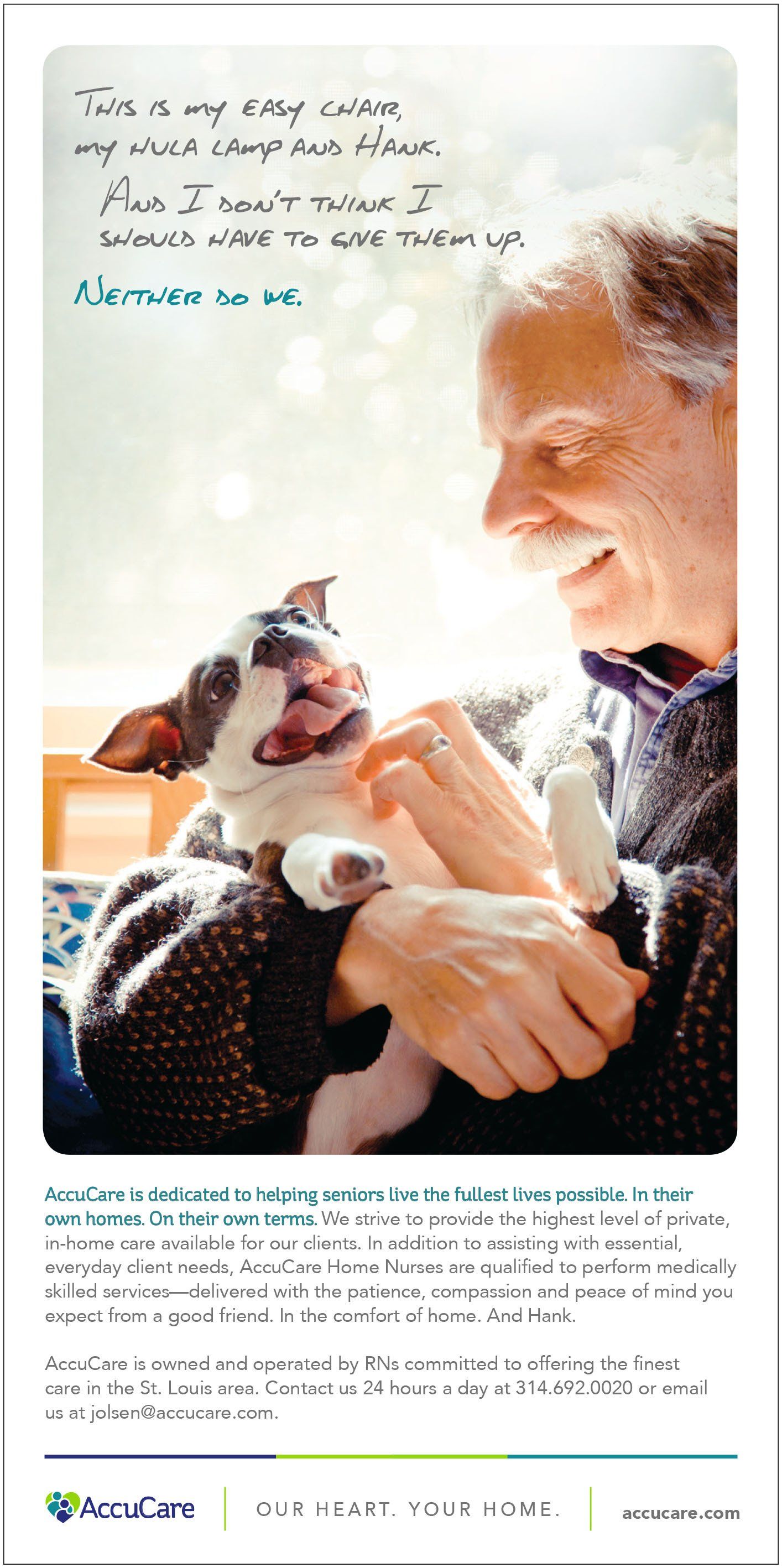 An elderly man is holding a small dog in his arms.