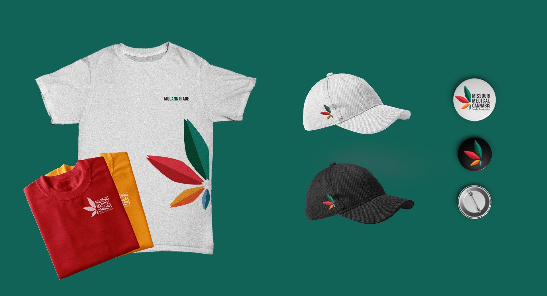 A t-shirt , hat , buttons , and a compass on a green background.
