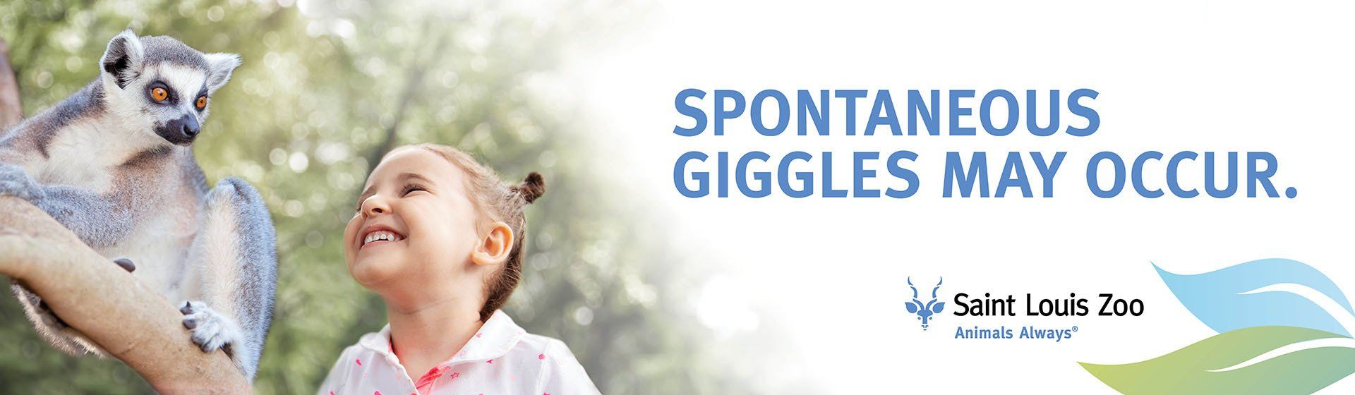 A little girl holding a lemur with the words spontaneous giggles may occur