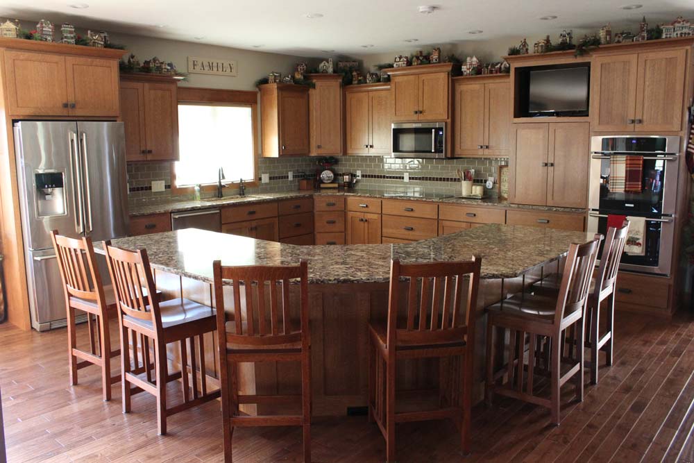 light wood kitchen cabinets and breakfast bar counter
