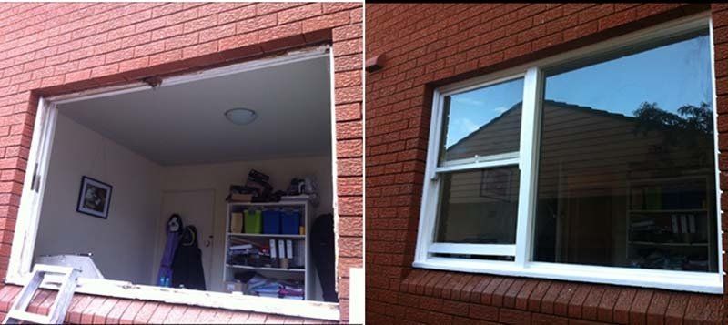 window installation on brick wall