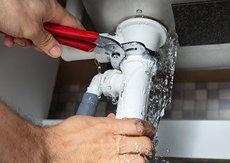 Professional Plumber — Plumber Fixing Sink Pipe in Denton, TX Professional Plumber — Plumber Fixing Sink Pipe in Denton, TX