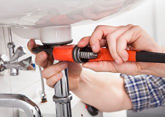 Drain Cleaning — Plumber Fixing Bathroom Sink in Denton, TX Drain Cleaning — Plumber Fixing Bathroom Sink in Denton, TX