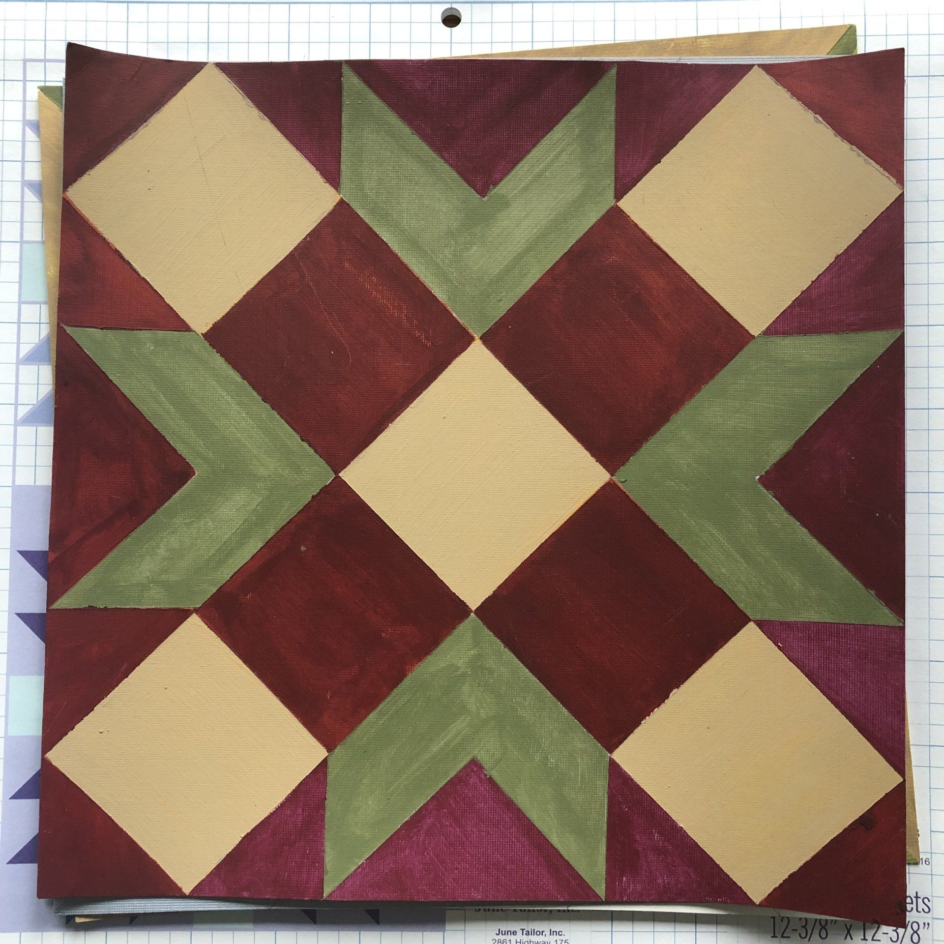 A painted rendering of a barn quilt design.