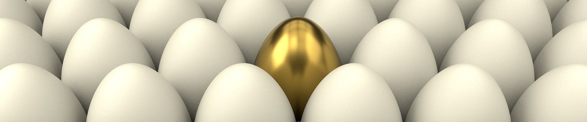 A golden object stands out among many white ones.