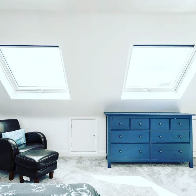 drawer and cushion chair in loft room