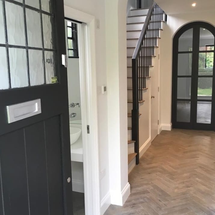 wooden flooring and steps in room