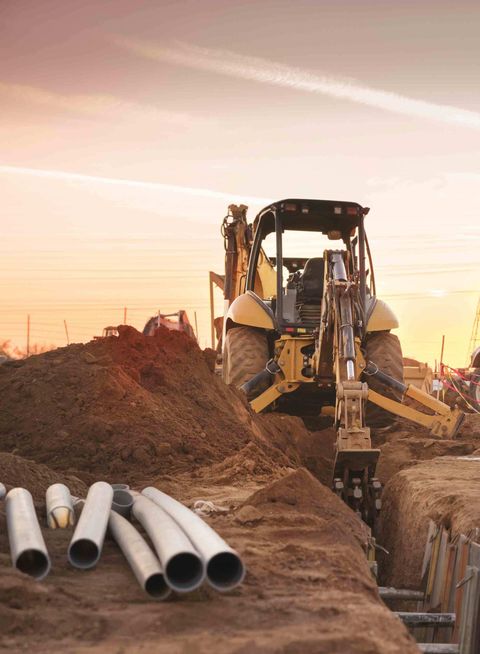 Bulldozer Carving Hole — Orrville, OH — Imhoff Construction Services Bulldozer Carving Hole — Orrville, OH — Imhoff Construction Services