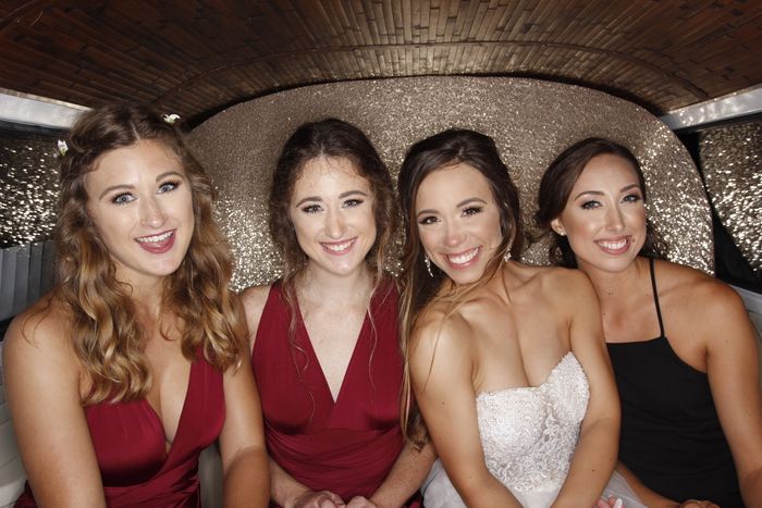 Bride and her bridesmaids taking  photos inside SunKissed Photo Bus in Chattanooga, TN