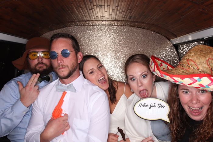 Wedding guests taking photos inside SunKissed Photo Bus in Chattanooga, TN