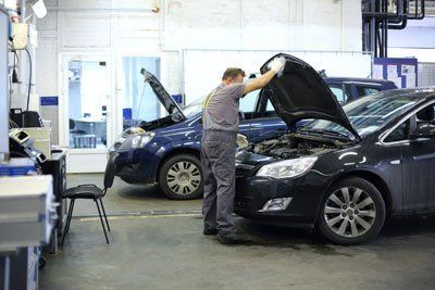 Professional doing the repair work in the garage