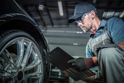 Mechanic Doing a Car Check — Automotive Services in Kundra Park, QLD Mechanic Doing a Car Check — Automotive Services in Kundra Park, QLD