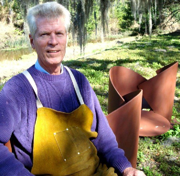 David Wilson with Metal Sculpture in Background