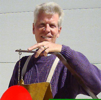 David Wilson holding a work of art in progress
