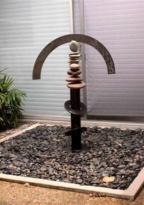 Scrap Metal and Stone Sculpture