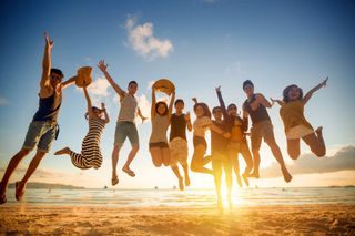 Group of Travelers Jumping — Group Travel in Denver, CO Group of Travelers Jumping — Group Travel in Denver, CO